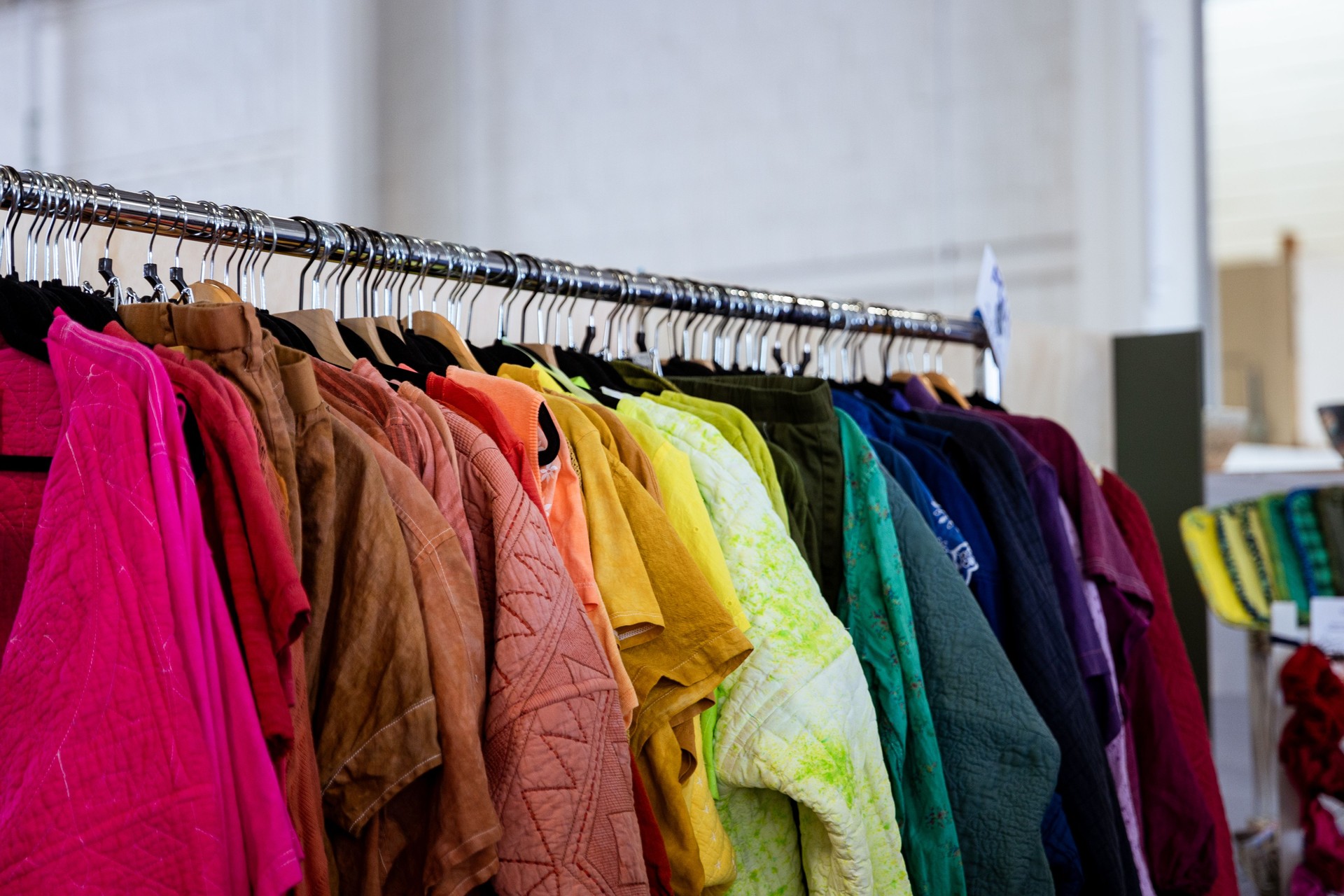 Colorful Vibrant Clothing Rack at a Thrift Store